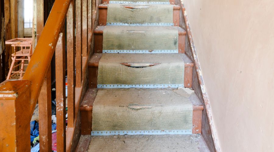 worn out staircase carpet