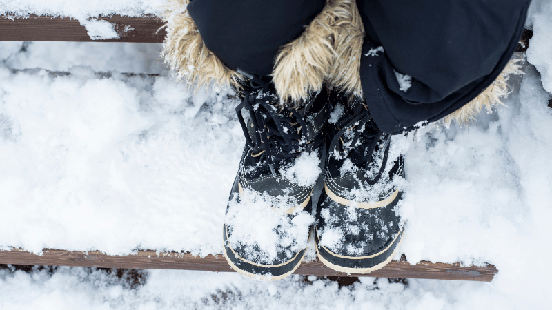 Boots covered with snow