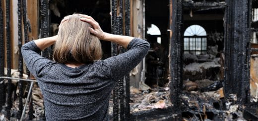 Fire Damage Restoration - Woman Stressed after her home has burned down