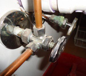 Check valves and connections near fixtures and appliances.