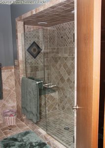 Glass shower door with tiles