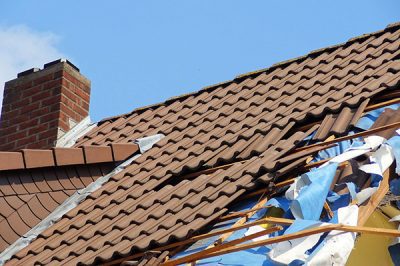 Roof damage is the most common type of storm damage .