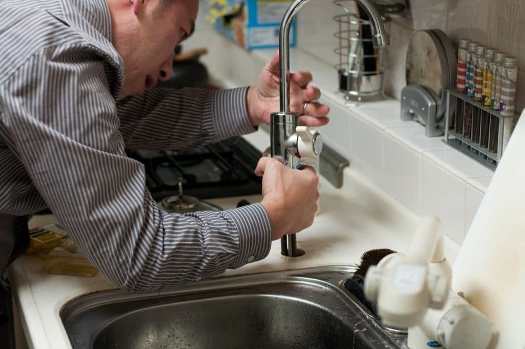 Guy-Working-on-Sink-Plumbing