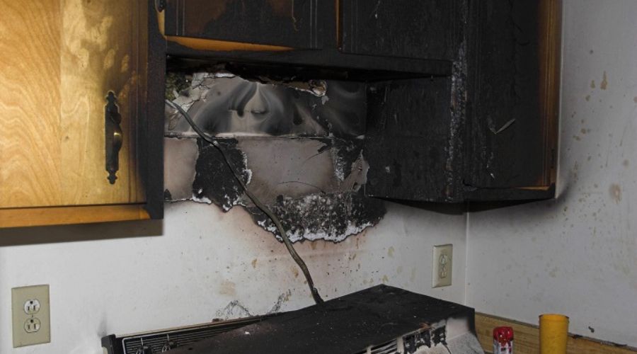 soot damage on kitchen walls and cabinets