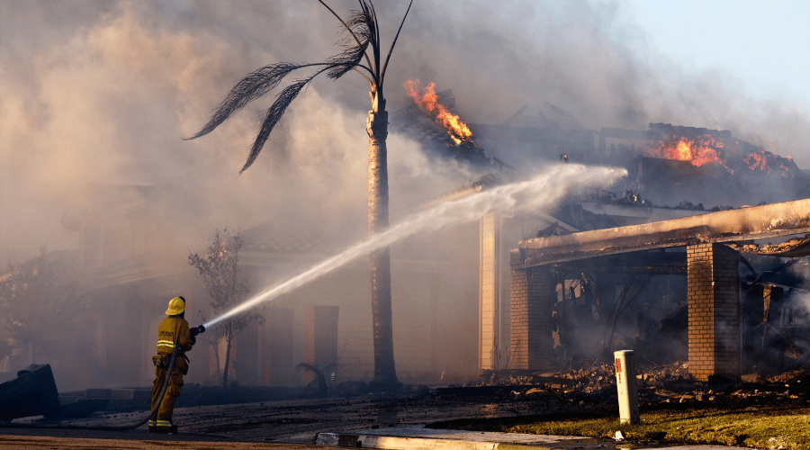 Fires hoses forcefully discharge massive amounts of water into a fire engulfed property