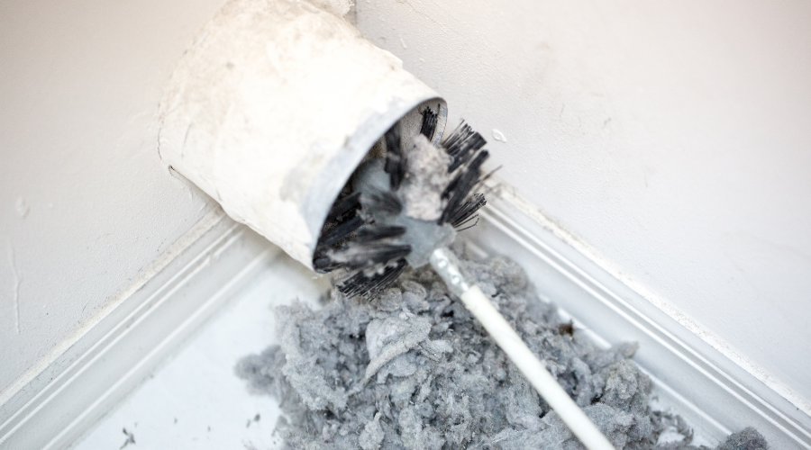 lint being removed from dryer vent