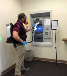 Ryan Mason Disinfecting ATM Area
